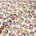 Tissu popeline coton aux petits filles façon bande dessinée - TissusPapi.com