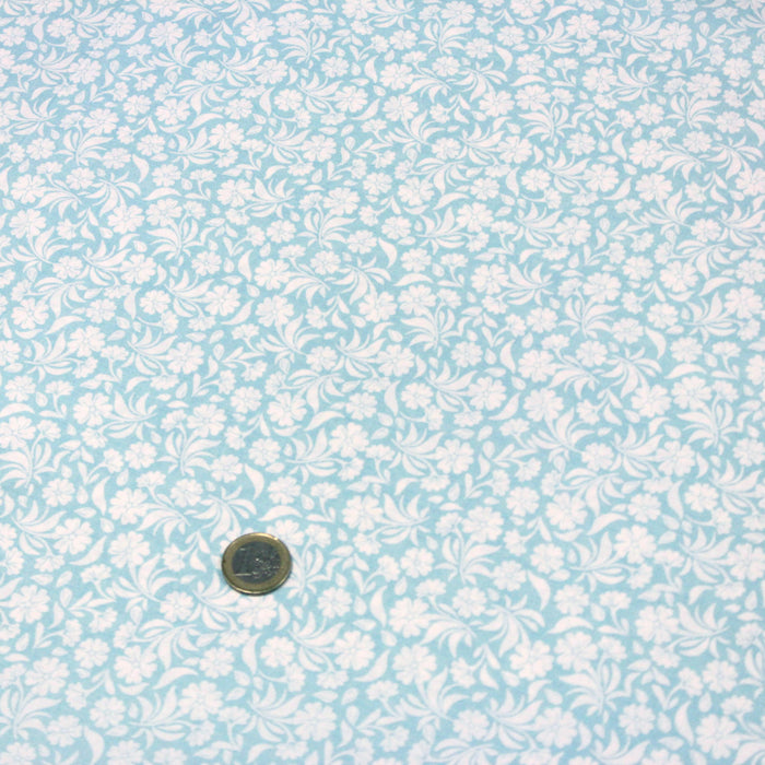 Tissu de coton fleuri, bleu ciel aux fleurs blanches - OEKO-TEX