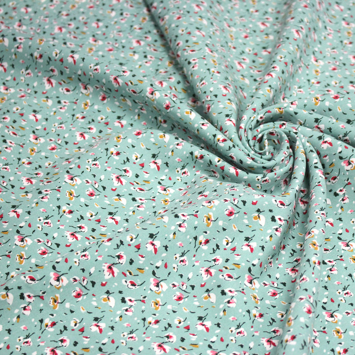 Tissu popeline de viscose bleu d'eau aux fines fleurs blanches et rose - Fabrication française - OEKO-TEX