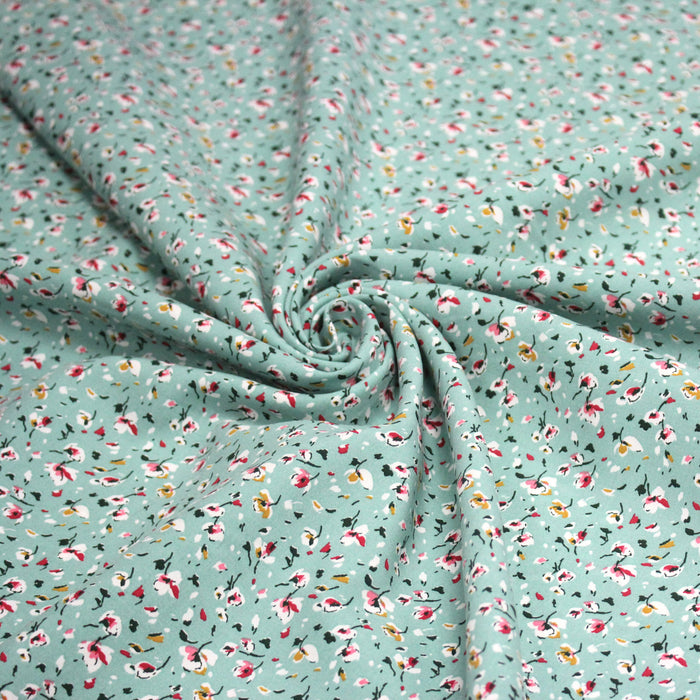 Tissu popeline de viscose bleu d'eau aux fines fleurs blanches et rose - Fabrication française - OEKO-TEX