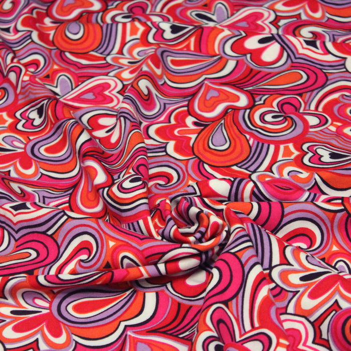Tissu Viscose fluide MIKA aux motifs seventies psychédéliques roses, mauves, rouges - OEKO-TEX