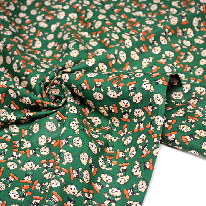 Tissu popeline coton vert au petit bonhomme, façon BD - TissusPapi.com