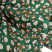 Tissu popeline coton vert au petit bonhomme, façon BD - TissusPapi.com