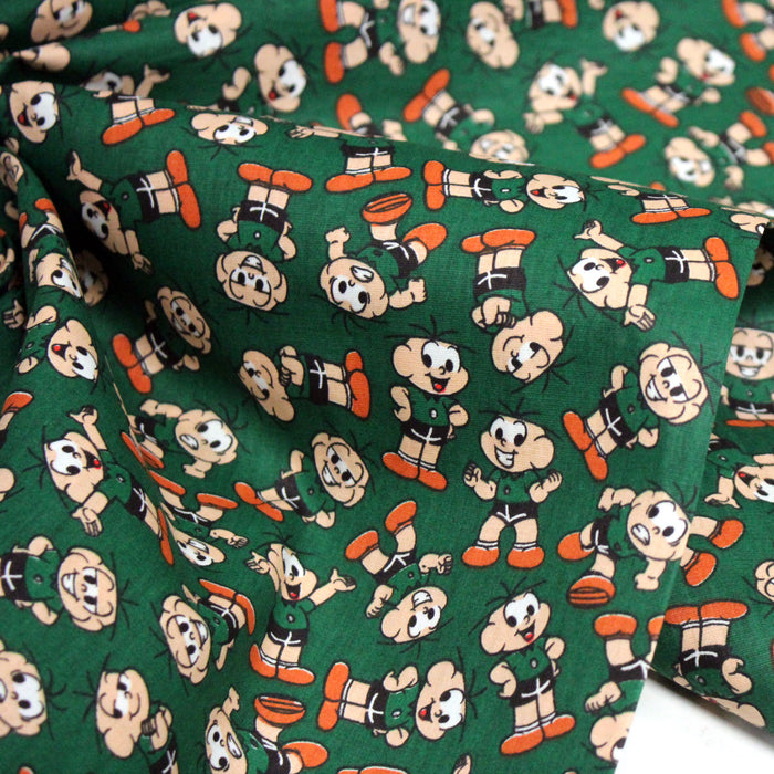 Tissu popeline coton vert au petit bonhomme, façon BD - TissusPapi.com