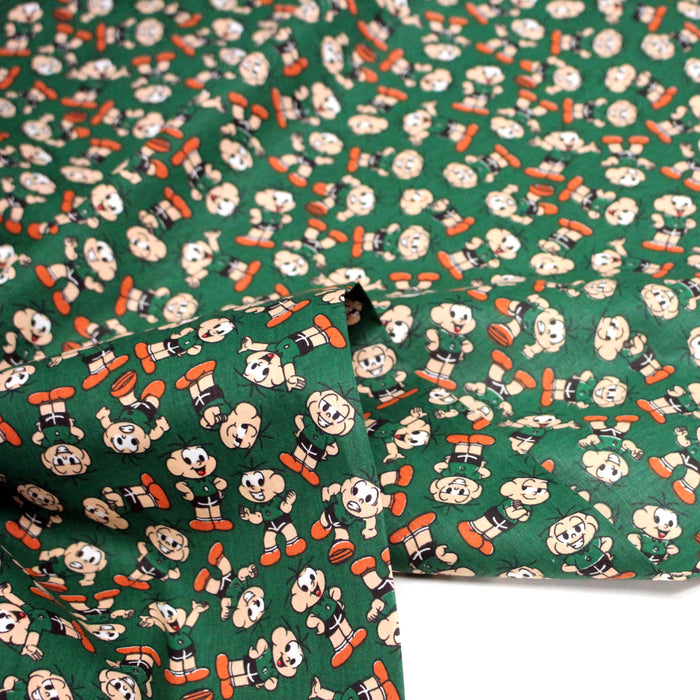 Tissu popeline coton vert au petit bonhomme, façon BD - TissusPapi.com
