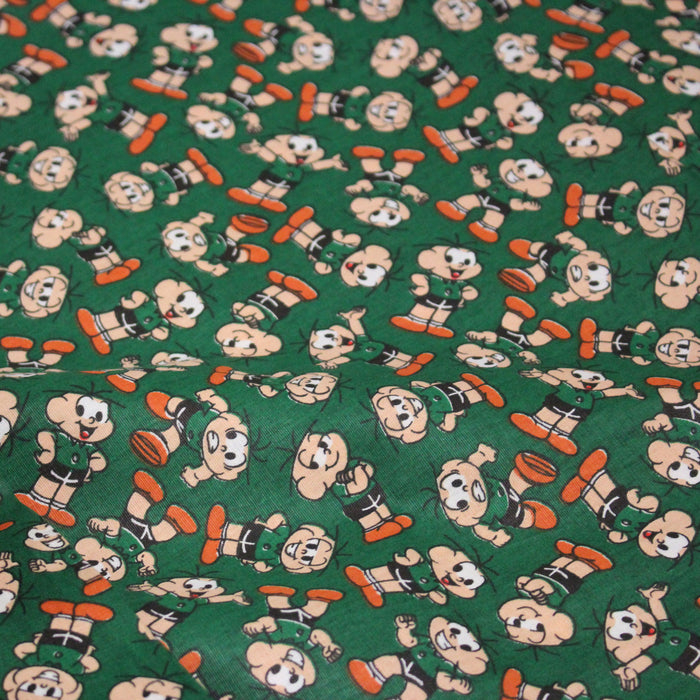 Tissu popeline coton vert au petit bonhomme, façon BD - TissusPapi.com