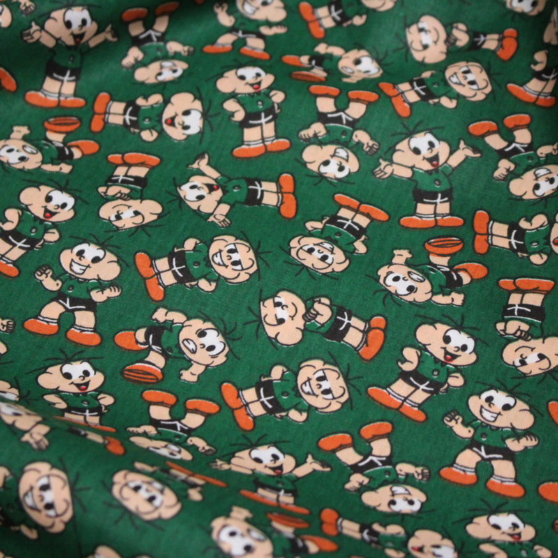 Tissu popeline coton vert au petit bonhomme, façon BD - TissusPapi.com