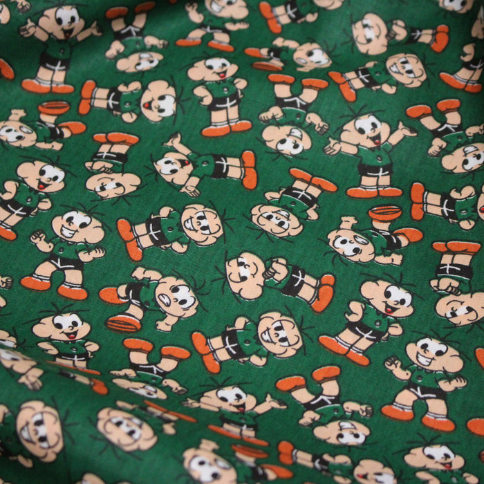 Tissu popeline coton vert au petit bonhomme, façon BD - TissusPapi.com