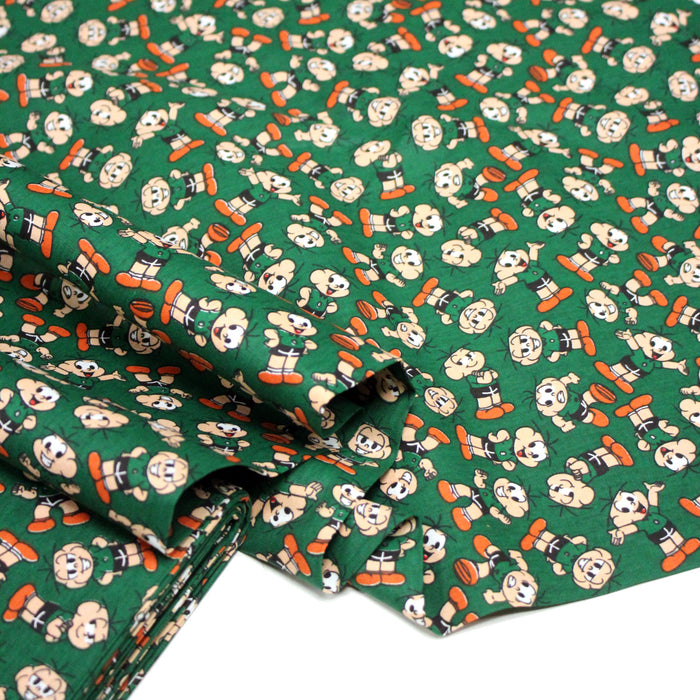 Tissu popeline coton vert au petit bonhomme, façon BD - TissusPapi.com