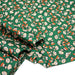 Tissu popeline coton vert au petit bonhomme, façon BD - TissusPapi.com