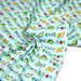 Tissu popeline coton DINO ROAR, bleu aux motifs dinosaures multicolores - TissusPapi.com
