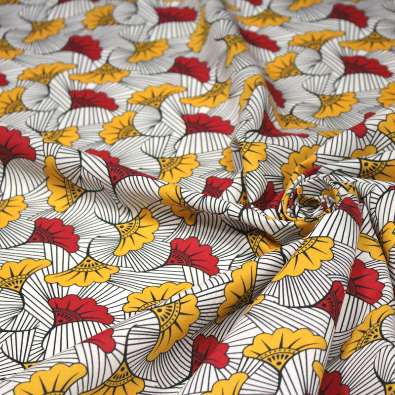 Tissu cotonnade motif WAX floral, fleurs rouges et jaunes - OEKO - TEX STANDARD 100 - TissusPapi.com
