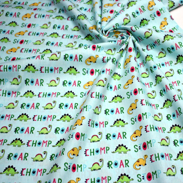 Tissu popeline coton DINO ROAR, bleu aux motifs dinosaures multicolores - TissusPapi.com