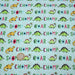 Tissu popeline coton DINO ROAR, bleu aux motifs dinosaures multicolores - TissusPapi.com