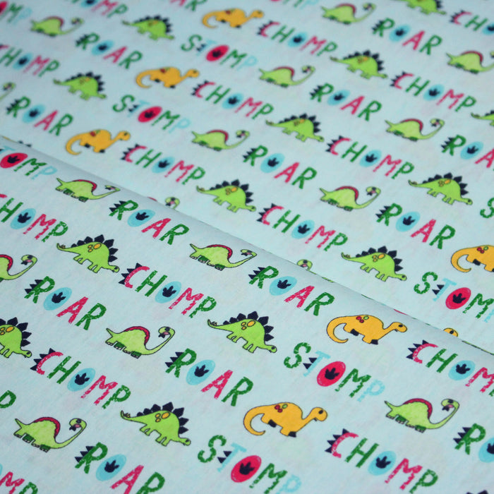Tissu popeline coton DINO ROAR, bleu aux motifs dinosaures multicolores - TissusPapi.com