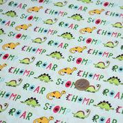 Tissu popeline coton DINO ROAR, bleu aux motifs dinosaures multicolores - TissusPapi.com