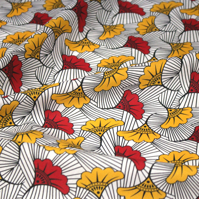 Tissu cotonnade motif WAX floral, fleurs rouges et jaunes - OEKO-TEX STANDARD 100