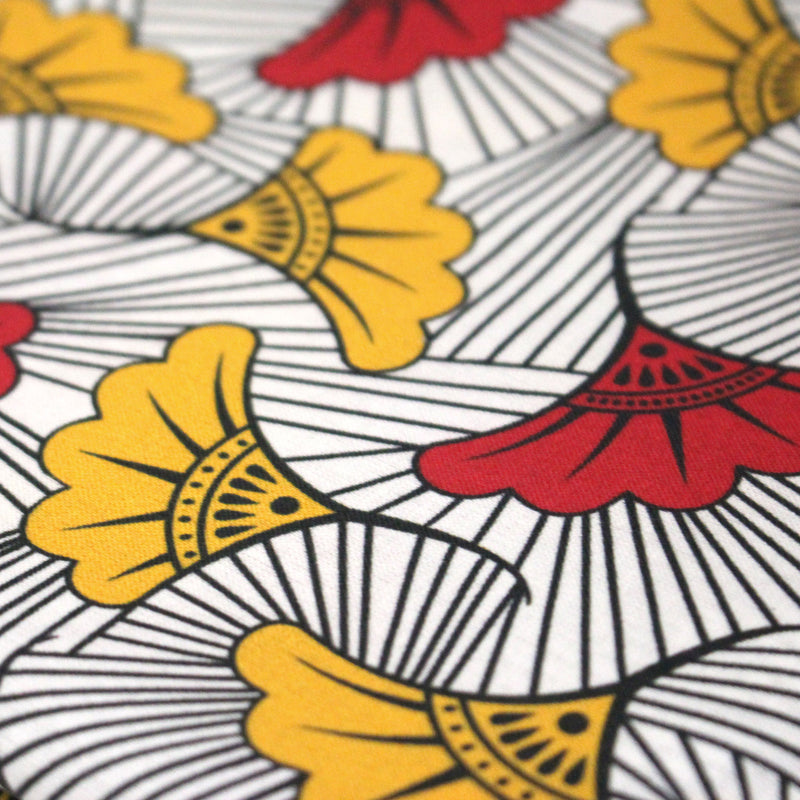 Tissu cotonnade motif WAX floral, fleurs rouges et jaunes - OEKO - TEX STANDARD 100 - TissusPapi.com