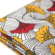 Tissu cotonnade motif WAX floral, fleurs rouges et jaunes - OEKO - TEX STANDARD 100 - TissusPapi.com