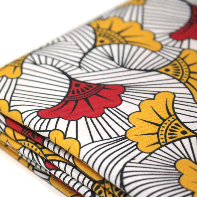Tissu cotonnade motif WAX floral, fleurs rouges et jaunes - OEKO - TEX STANDARD 100 - TissusPapi.com