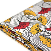 Tissu cotonnade motif WAX floral, fleurs rouges et jaunes - OEKO - TEX STANDARD 100 - TissusPapi.com