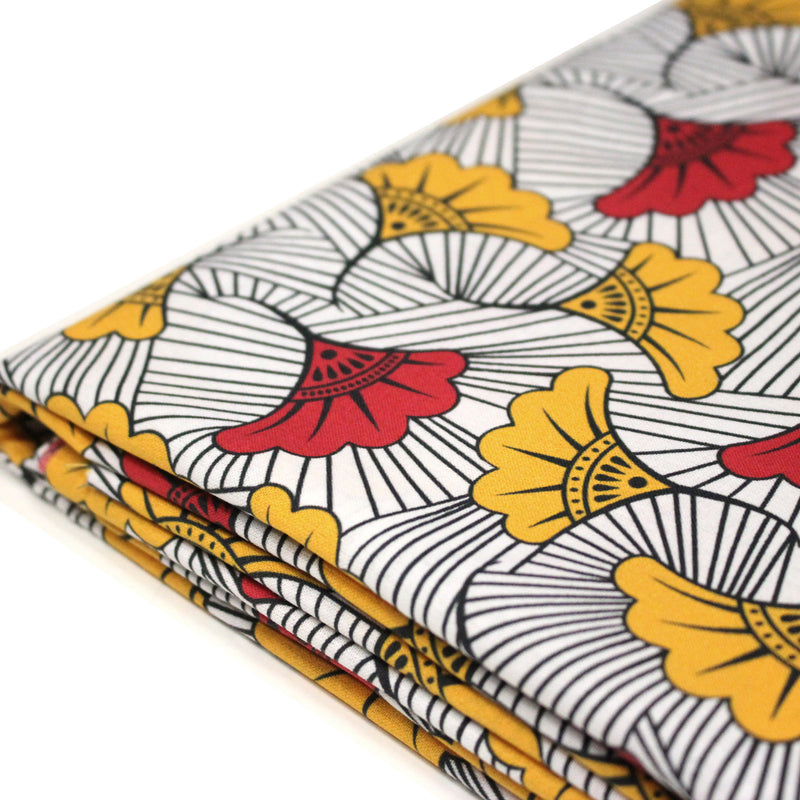 Tissu cotonnade motif WAX floral, fleurs rouges et jaunes - OEKO - TEX STANDARD 100 - TissusPapi.com
