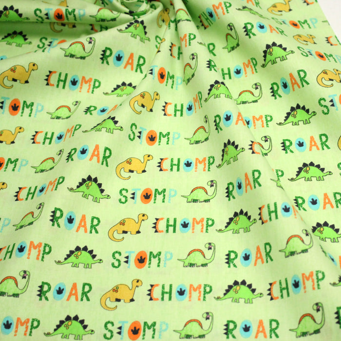 Tissu popeline coton DINO ROAR, vert aux motifs dinosaures multicolores - TissusPapi.com