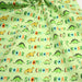 Tissu popeline coton DINO ROAR, vert aux motifs dinosaures multicolores - TissusPapi.com