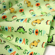 Tissu popeline coton DINO ROAR, vert aux motifs dinosaures multicolores - TissusPapi.com