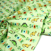 Tissu popeline coton DINO ROAR, vert aux motifs dinosaures multicolores - TissusPapi.com