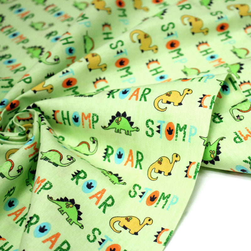 Tissu popeline coton DINO ROAR, vert aux motifs dinosaures multicolores - TissusPapi.com