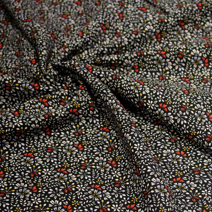 Tissu popeline de viscose noir aux fines fleurs blanches, mauves et rouge - Fabrication française - OEKO-TEX