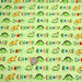 Tissu popeline coton DINO ROAR, vert aux motifs dinosaures multicolores - TissusPapi.com