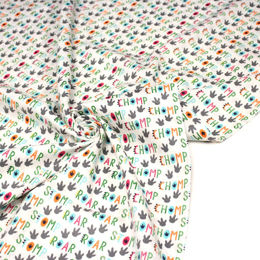 Tissu popeline coton DINO ROAR, blanc aux motifs dinosaures multicolores - TissusPapi.com