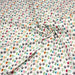 Tissu popeline coton DINO ROAR, blanc aux motifs dinosaures multicolores - TissusPapi.com