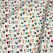 Tissu popeline coton DINO ROAR, blanc aux motifs dinosaures multicolores - TissusPapi.com