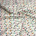 Tissu popeline coton DINO ROAR, blanc aux motifs dinosaures multicolores - TissusPapi.com