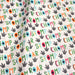 Tissu popeline coton DINO ROAR, blanc aux motifs dinosaures multicolores - TissusPapi.com
