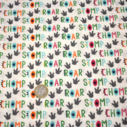 Tissu popeline coton DINO ROAR, blanc aux motifs dinosaures multicolores - TissusPapi.com