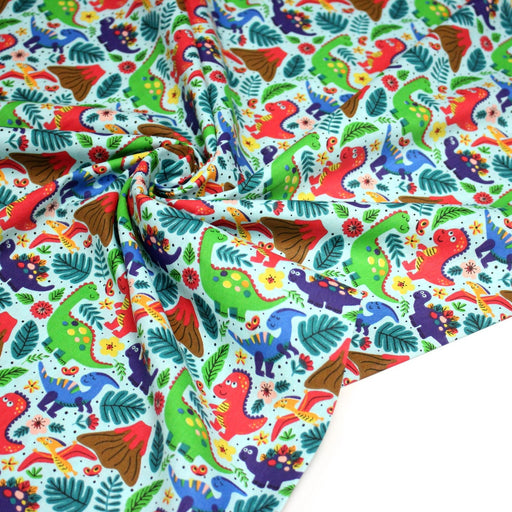 Tissu popeline coton bleu ciel aux dinosaures multicolores - TissusPapi.com