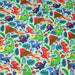 Tissu popeline coton bleu ciel aux dinosaures multicolores - TissusPapi.com