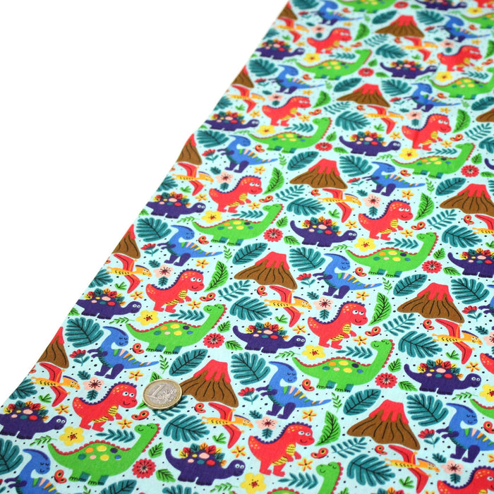 Tissu popeline coton bleu ciel aux dinosaures multicolores - TissusPapi.com