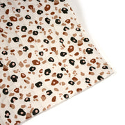 Tissu matelassé LEOPARD, écru et taches léopard noires, roses, ocres - OEKO - TEX - TissusPapi.com