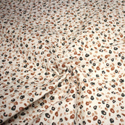 Tissu matelassé LEOPARD, écru et taches léopard noires, roses, ocres - OEKO - TEX - TissusPapi.com