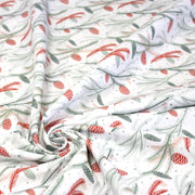 Tissu coton NOËL blanc aux branches sapins et pommes de pin rouges - OEKO - TEX - TissusPapi.com