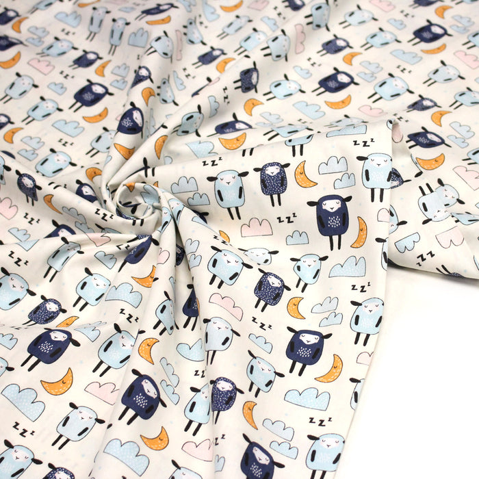 Tissu popeline coton Les montons font dodo, tons écrus bleus oranges - TissusPapi.com