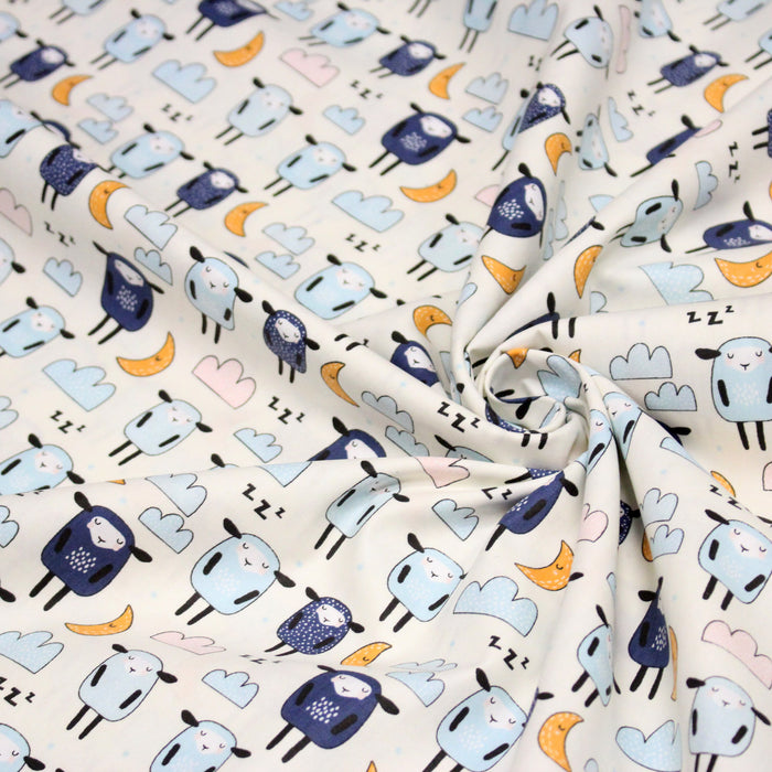 Tissu popeline coton Les montons font dodo, tons écrus bleus oranges - TissusPapi.com