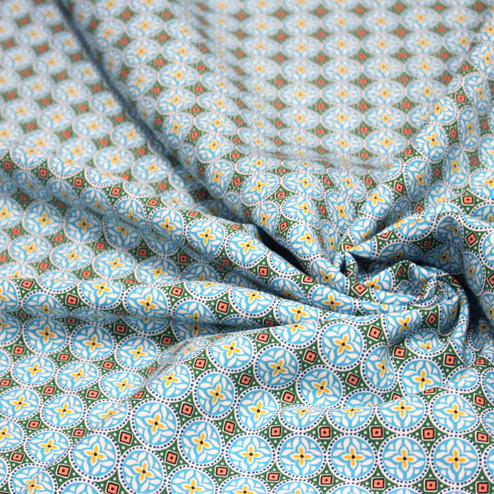 Tissu popeline de viscose aux motifs géométriques bleu turquoise moucharabieh - Fabrication française - OEKO-TEX