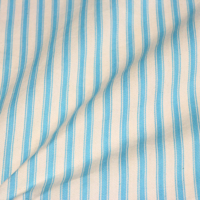 Tissu toile à matelas de coton CARNAC aux rayures bleu turquoise, fond écru
