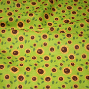 Tissu popeline coton vert aux tournesols jaunes & feuilles vertes - TissusPapi.com